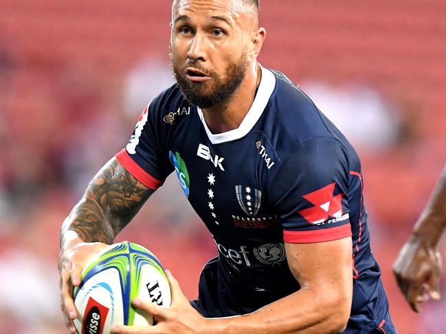 Rebels five-eighth Quade Cooper runs the ball against the Reds on Saturday night. Picture: Getty Images