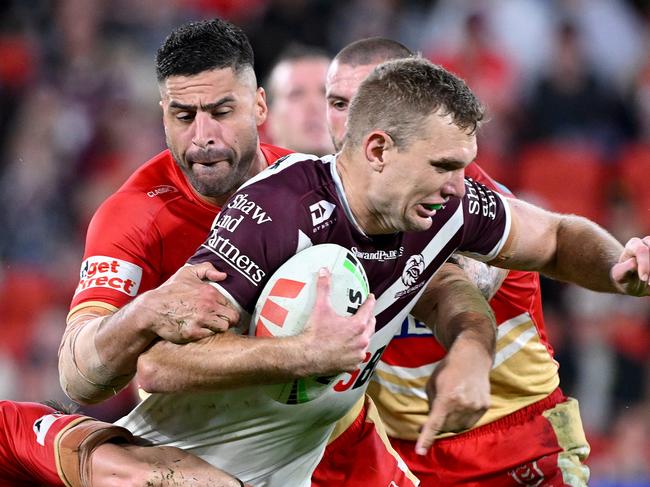 BRISBANE, AUSTRALIA - MAY 09: Tom Trbojevic of the Sea Eagles is tackled during the round ten NRL match between the Dolphins and the Manly Sea Eagles at Kayo Stadium, on May 09, 2024, in Brisbane, Australia. (Photo by Bradley Kanaris/Getty Images)