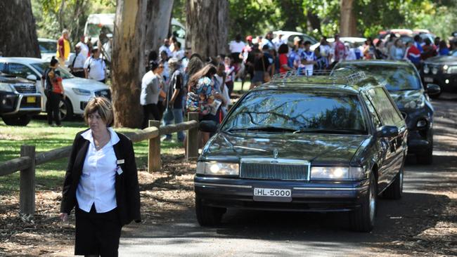 Mourners lined the park as they came to say goodbye. Picture: Colin Rouse