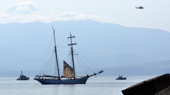 This photograph shows a Coast Guard boat with Italian fireboats and an Italian fire brigade helicopter search for the missing passengers. Picture: AFP