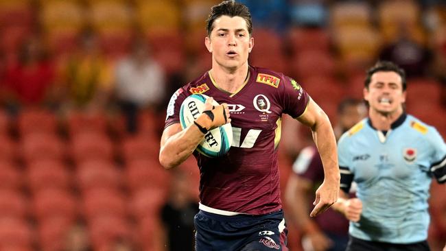 BRISBANE, AUSTRALIA - MARCH 26: Jock Campbell of the Reds breaks away to score a try during the round six Super Rugby Pacific match between the Queensland Reds and the NSW Waratahs at Suncorp Stadium on March 26, 2022 in Brisbane, Australia. (Photo by Dan Peled/Getty Images)