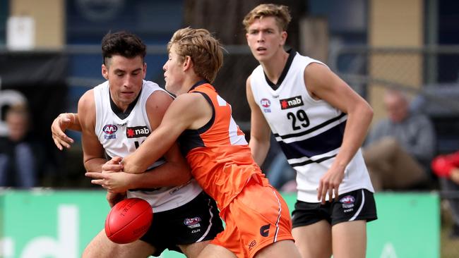 Sunny Brazier is tackled in the clash against GWS Academy.