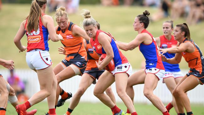 Melbourne’s Brooke Patterson in traffic against the Giants. Picture: AAP