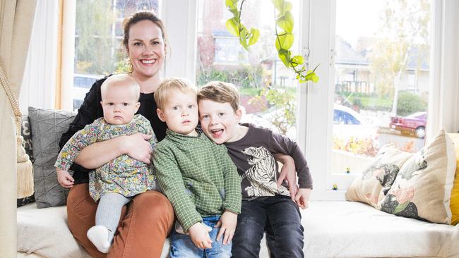 Katherine Webster with her 3 children Eleanor, 9 months, Patrick, 3 (in green) and Owen, 3 (in brown) in their West Hobart home. Picture: RICHARD JUPE