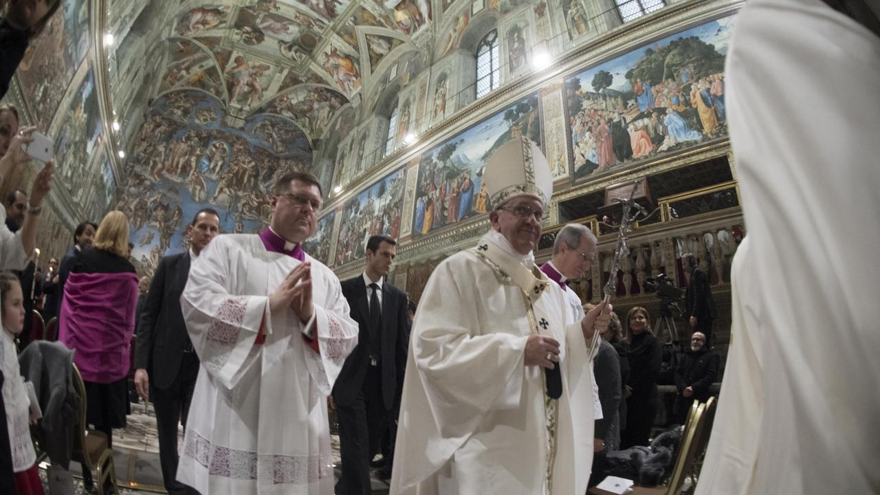 Pope Francis in the Sistine Chapel, where Rapahel’s 12 tapestries are displayed for the first time in more than 400 years. Picture: AFP/Osservatore Romano