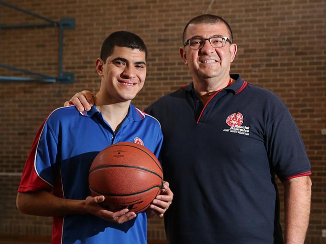 Elias Habelrith and his son Richard pose for a photo at South Sydney High School on the 24th of August, 2017.Elias Habelrith coaches the Special Olympics Eastern Sydney Team which his son Richard is a member.(AAP IMAGE/ Danny Aarons)