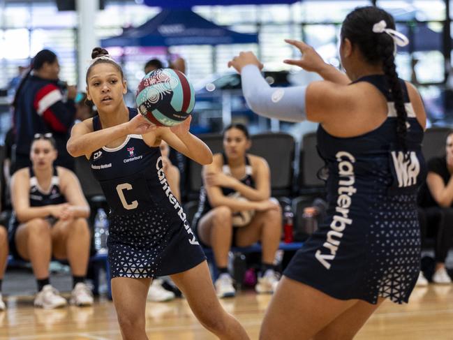 Canterbury College (navy blue) vs. Xavier Catholic College (black and gold). Canterbury CollegeÃ¢â&#130;¬â&#132;¢s Aaliyah Frescon-Sheppard makes a pass.