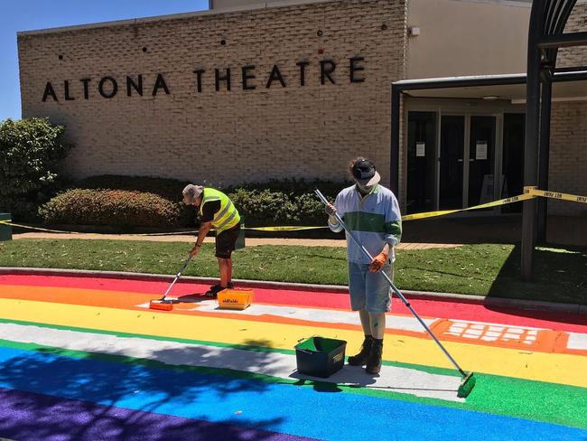 Artists paint the ‘rainbow road’ outside Hobsons Bay Council offices in Altona. Picture: Industrial Art Sign Co