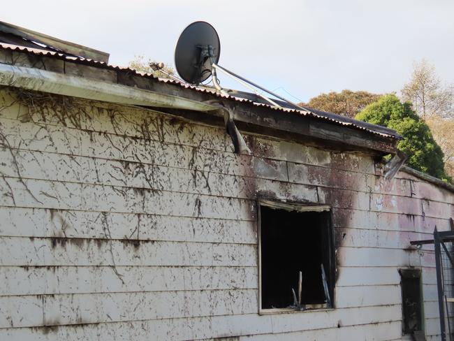 The side of the fire-damaged home.