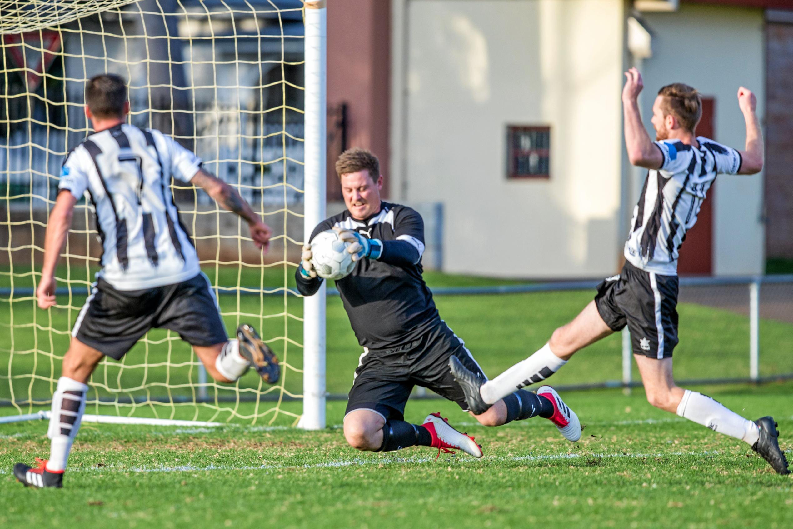 USQ FC keeper Matt Eilers makes a save. Picture: Paul Smith