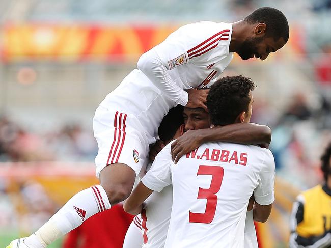 CANBERRA, AUSTRALIA - JANUARY 11: United Arab Emirates players celebrate a goal during the 2015 Asian Cup match between the United Arab Emirates and Qatar at Canberra Stadium on January 11, 2015 in Canberra, Australia. (Photo by Stefan Postles/Getty Images)