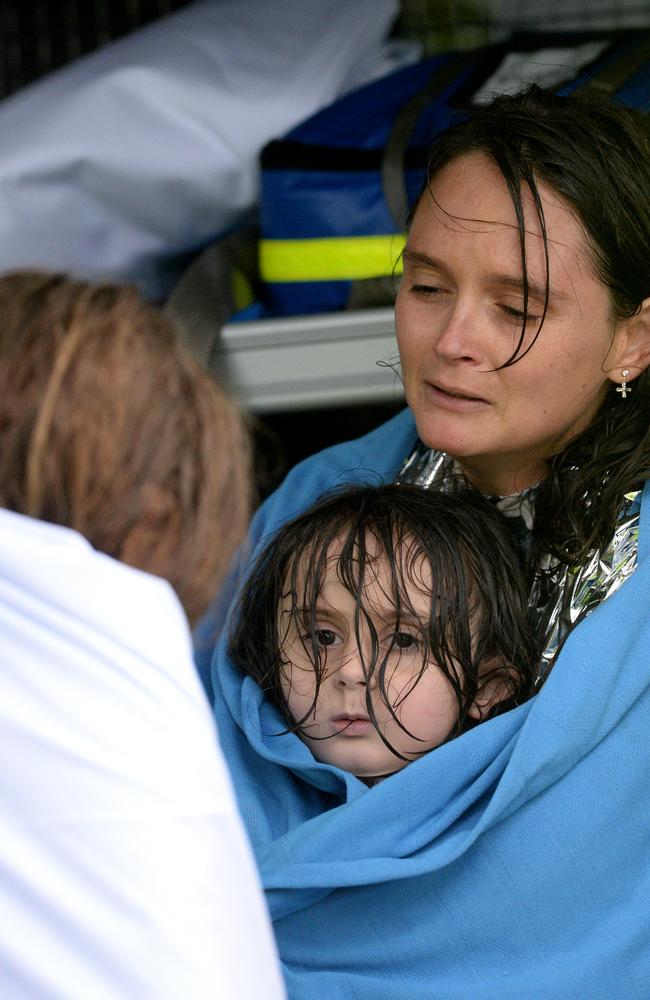 A family is rescued from floodwaters as the water levels threatened their Upper Colo home. The dramatic rescue continued after the rescue vessel capsized in the floodwaters of the Hawkesbury River throwing the family into the water. The family was brought to safety in Sackville, NSW. Picture: NCA NewsWire / Jeremy Piper