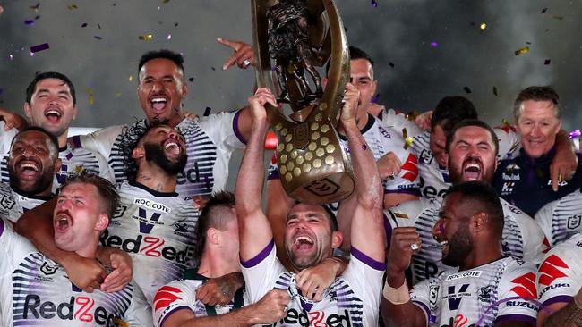 SYDNEY, AUSTRALIA - OCTOBER 25: Cameron Smith of the Storm holds aloft the Premiership trophy and celebrates with team mates after winning the 2020 NRL Grand Final match between the Penrith Panthers and the Melbourne Storm at ANZ Stadium on October 25, 2020 in Sydney, Australia. (Photo by Cameron Spencer/Getty Images)