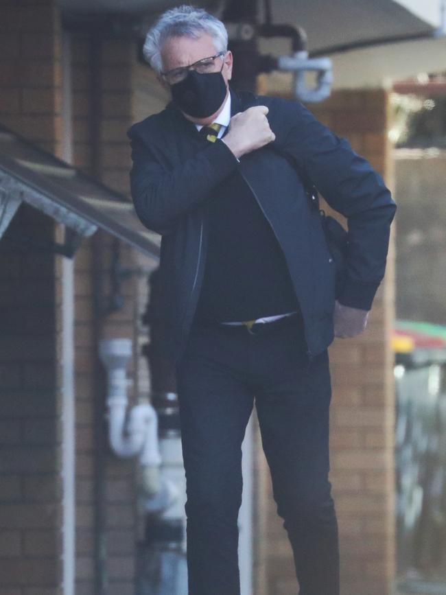 Michael Podgoetsky leaves his Bondi unit. Picture: John Grainger