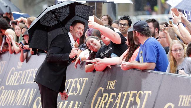 Jackman greets fans and poses for selfies. Picture: Christian Gilles