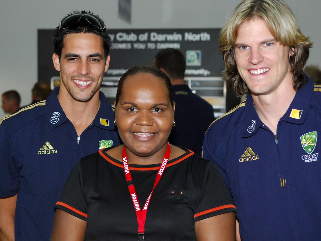 Australian cricketer Mitchell Johnson with Yana Humes and Bracken at Darwin Airport. Picture: Brad Fleet.