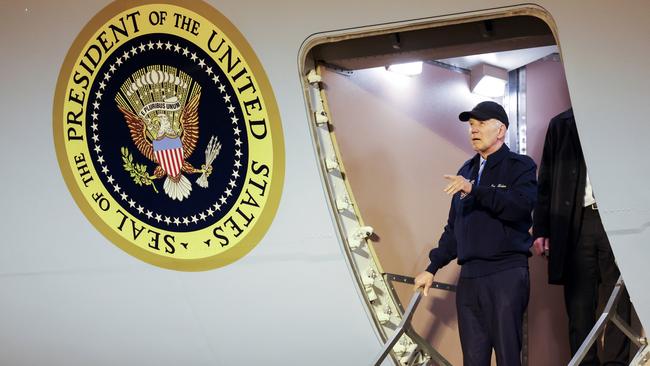 US President Joe Biden gestures as he deboards Air Force One, at Dover Air Force Base in Dover, Delaware.