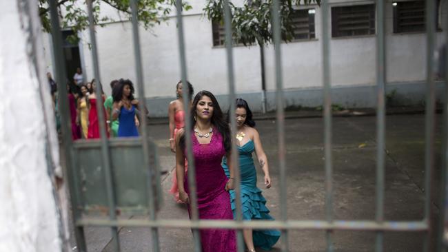 Female inmates wear evening gowns on the morning of their annual beauty contest. Picture: AP Photo/Silvia Izquierdo.