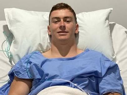 Kade Dykes in hospital after tearing his ACL on his 21st birthday in 2023.