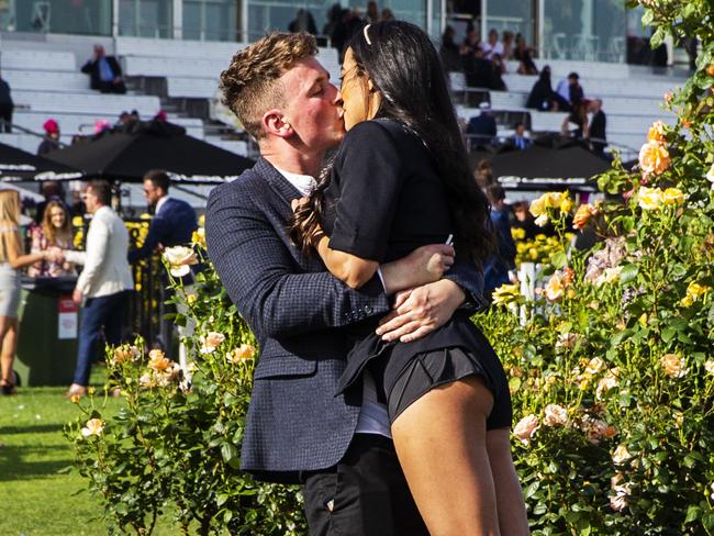 MELBOURNE, AUSTRALIA - NOVEMBER 05: Race-goers share a kiss after the 2019 Melbourne Cup Day at Flemington Racecourse on November 05, 2019 in Melbourne, Australia. (Photo by Jenny Evans/Getty Images)