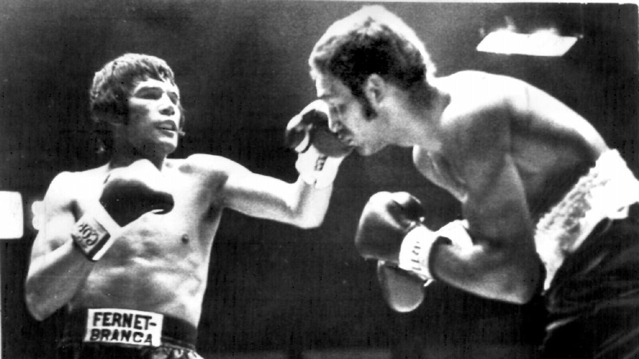 World Middleweight boxing champion 1970-77 Carlos Monzon (L) lands left to challenger Tony Mundine during their 1975 title fight. Picture: UPI Sport