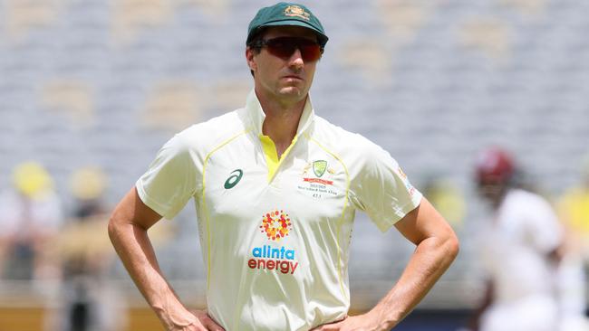 Australia's captain Pat Cummins looks on during the fifth day of the first Test cricket match between Australia and the West Indies at Perth Stadium in Perth on December 4, 2022. (Photo by TREVOR COLLENS / AFP) / — IMAGE RESTRICTED TO EDITORIAL USE – STRICTLY NO COMMERCIAL USE —