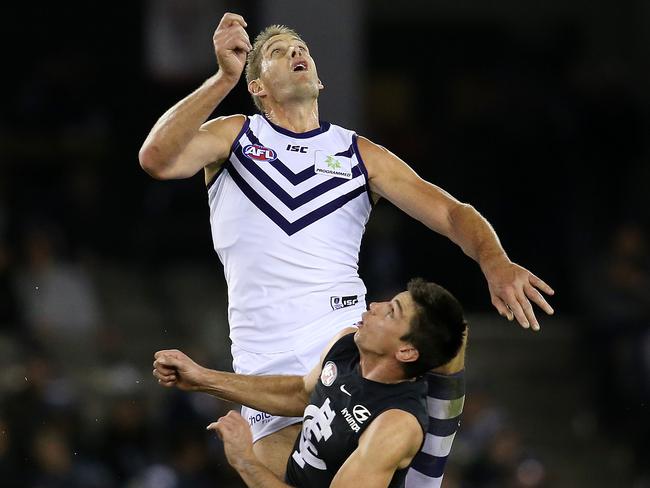 Fremantle’s Aaron Sandilands climbs over Carlton’s Matthew Kreuzer last season. Picture: Michael Klein