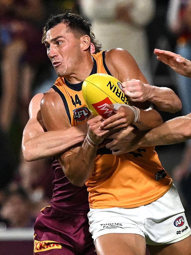 Cumming tries to get a handball away during pre-season. Picture: Bradley Kanaris/Getty Images