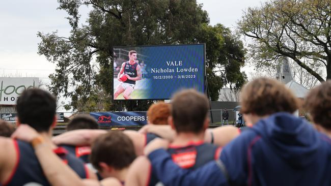 Highlights of Lowden’s playing career was shown on the big screen before the minute’s silence. Picture: SANFL Image/David Mariuz