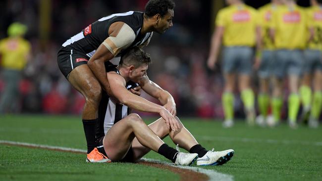 Travis Varcoe lifts Taylor Adams from the turf after the thriller. Pic: AAP