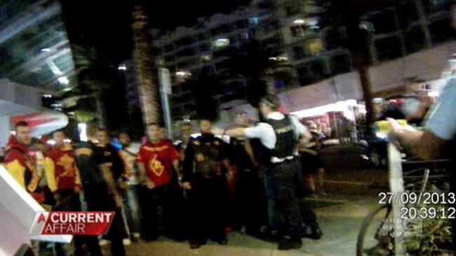 Police pull out Tasers after being called to the chaotic scene. Picture: A Current Affair