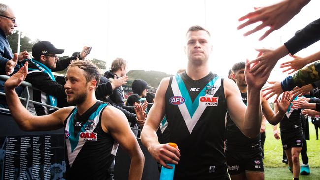 Peter Ladhams (right) walks off with Cam Sutcliffe. Picture: Daniel Kalisz/Getty Images