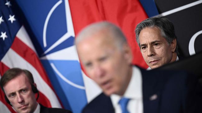 US President Joe Biden (C) flanked by Secretary of State Antony Blinken (R) and US National Security Advisor Jake Sullivan (L).