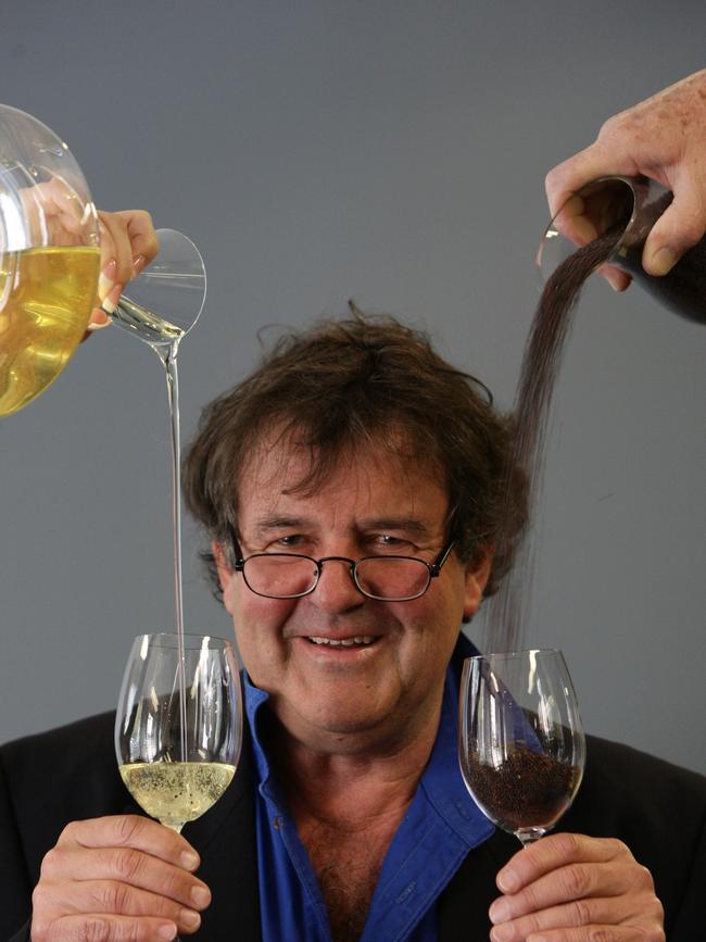 Two Dogs' and Kangaroo Island Pure Grain’s Duncan MacGillivray with glasses of canola seed and canola oil.