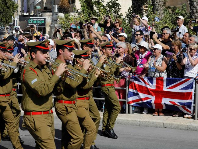 Musicians from the Israeli army orchestra perform as members of the Australian Light Horse association ride through Beersheba, in the northern Israeli desert. Picture: AFP.