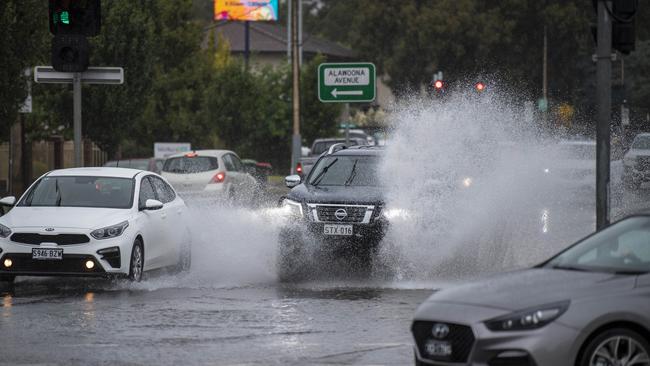 Traffic on Marion Rd battle flooding near the Finnis St intersection. Picture: Mark Brake