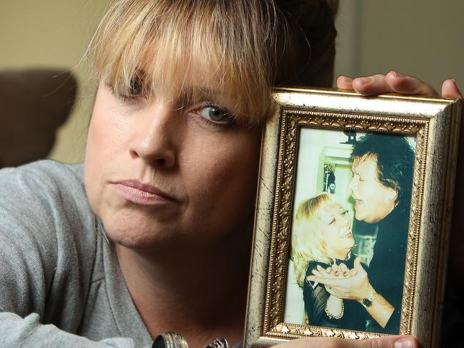 Terence and Christine Hodson inquest. Daughter Mandy Hodson holds a photo of her parents. Terrence Hodson.