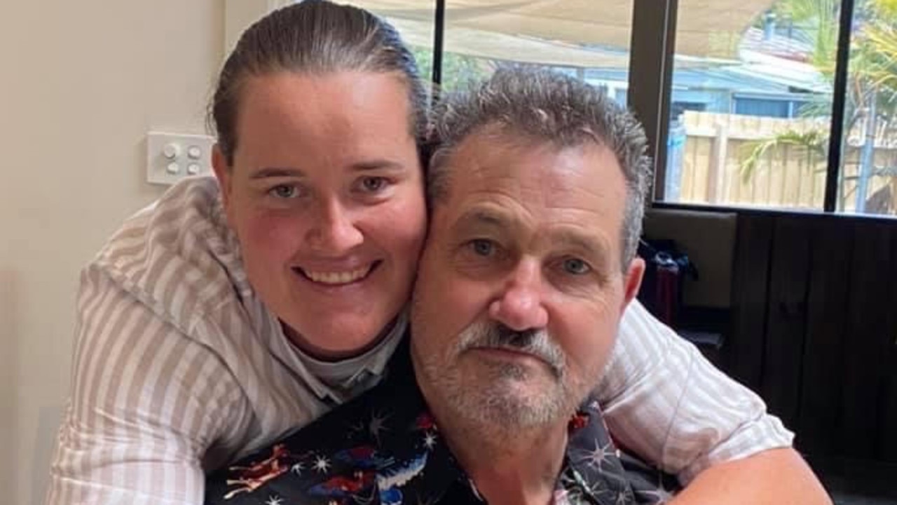 AFLW player Sarah Perkins with her dad — and mad Hawk — Ken. Picture: Supplied