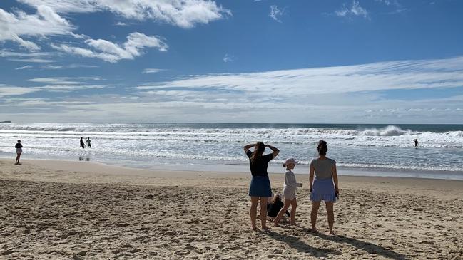 Surf Life Saving Queensland lifeguards rescued a woman and boy from rough surf at Alexandra Headland on Sunday morning.