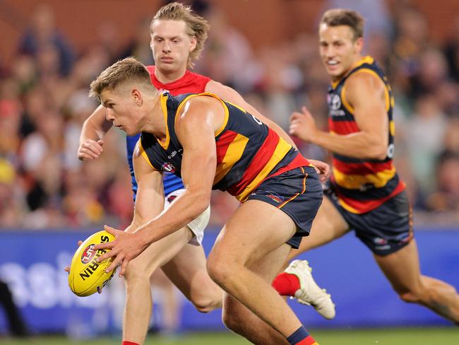 ADELAIDE, AUSTRALIA - MAY 22: Nick Murray of the Crows handballs in the final seconds during the round 10 AFL match between the Adelaide Crows and the Melbourne Demons at Adelaide Oval on May 22, 2021 in Adelaide, Australia. (Photo by Daniel Kalisz/Getty Images)