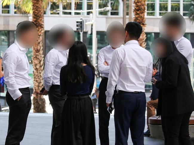 SYDNEY, AUSTRALIA - NewsWire Photos, NOVEMBER 16 2021:  Sydney siders wearing suits are seen getting coffee during lunch hour in the CBD, in Sydney. Picture: NCA Newswire / Gaye Gerard