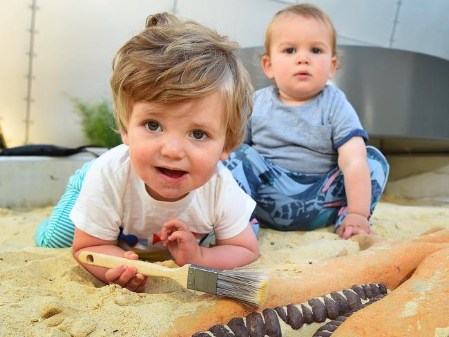 One-year-olds Gus and Domenic testing the sandpit at Melbourne Museum’s new children’s gallery. Picture: Josie Hayden