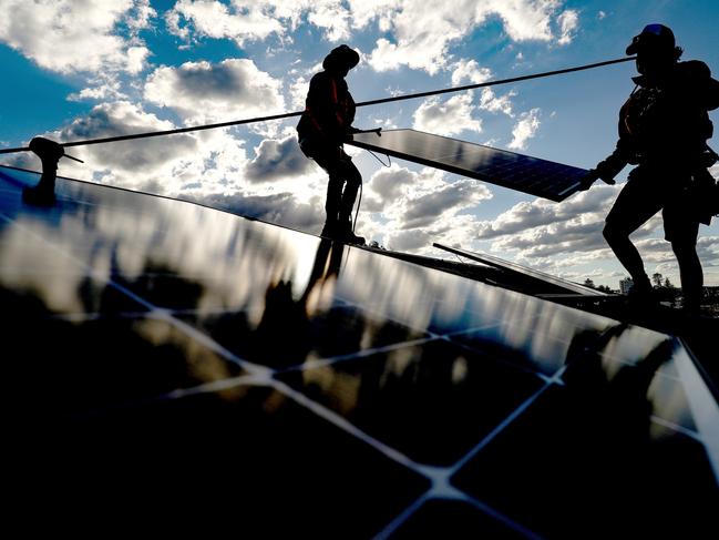 Bloomberg Best of the Year 2021: Solarpro employees install LG Electronics Inc. NeON R 370W solar panels onto the rooftop of a residential property in Sydney, Australia, on Monday, May 17, 2021. Photographer: Brendon Thorne/Bloomberg via Getty Images