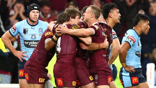 BRISBANE, AUSTRALIA - JULY 13:  Kurt Capewell of the Maroons celebrates with team mates after scoring a try during game three of the State of Origin Series between the Queensland Maroons and the New South Wales Blues at Suncorp Stadium on July 13, 2022, in Brisbane, Australia. (Photo by Chris Hyde/Getty Images)