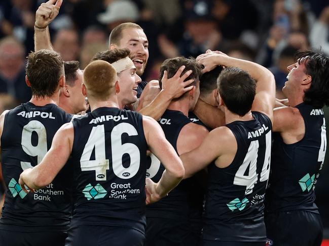 MELBOURNE, AUSTRALIA – APRIL 20: Blues players celebrate during the 2024 AFL Round 06 match between the Carlton Blues and the GWS GIANTS at Marvel Stadium on April 20, 2024 in Melbourne, Australia. (Photo by Michael Willson/AFL Photos via Getty Images)