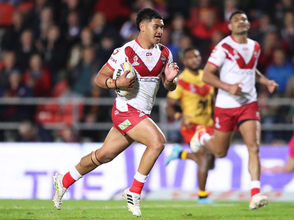 Isaiya Katoa, pictured playing for Tonga, is unlikely to play round one for the Dolphins. Picture: Charlotte Tattersall/Getty Images for RLWC