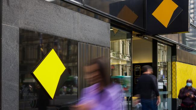 MELBOURNE, AUSTRALIA - MAY 03: People are seen walking past a Commonwealth Bank of Australia branch on May 03, 2022 in Melbourne, Australia. The Reserve Bank of Australia has today lifted the official interest rate to 0.35 per cent following a meeting today. The rise is the first interest rate increase since November 2010. (Photo by Asanka Ratnayake/Getty Images)