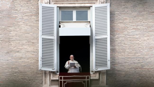 Pope Francis addresses the crowd from the window of the apostolic palace overlooking Saint Peter's S. Picture: Tiziana Fabi/AFP