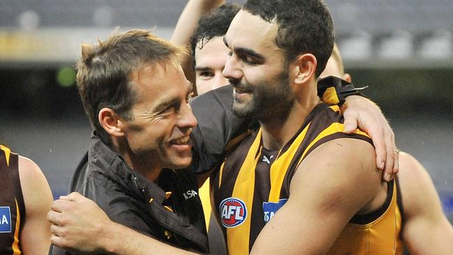 Hawthorn coach Alastair Clarkson hugs Shaun Burgoyne after a win.