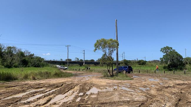 Police and Aurizon on scene where a teenage boy was electrocuted after climbing and swinging off a power pole near the train bridge across Auckland Creek.